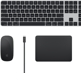 Top view of Mac accessories: Magic Keyboard, Magic Mouse, Magic Trackpad and Thunderbolt cables.